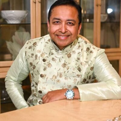 Rang-e-Mohabbat male artist seated portrait smiling