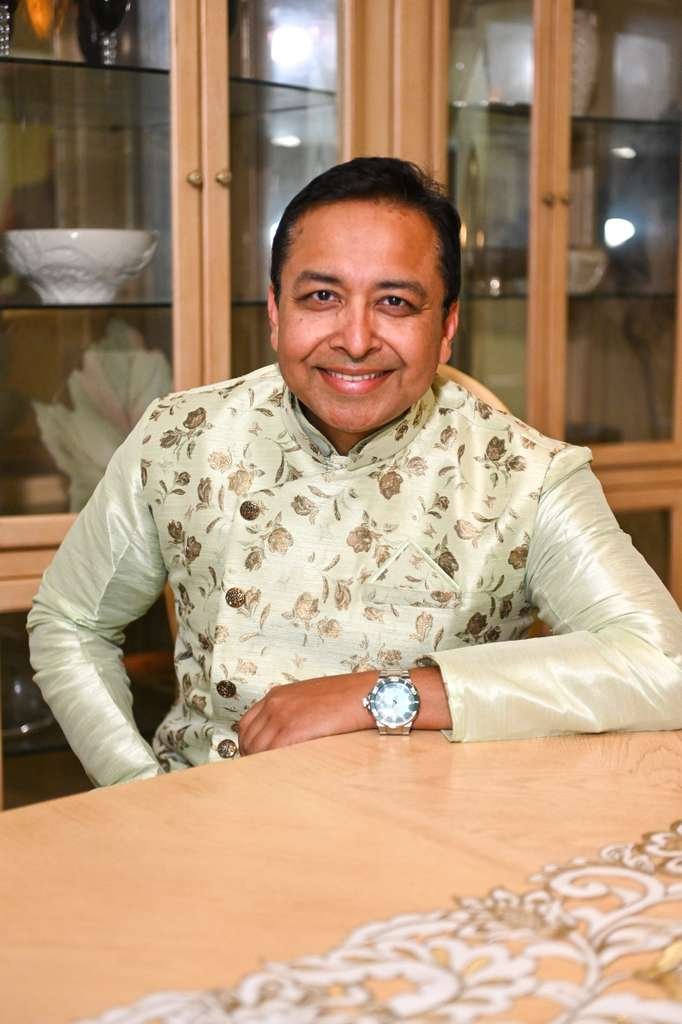 Rang-e-Mohabbat male artist seated portrait smiling