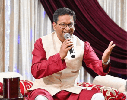 Male ghazal singer performing seated on stage – Rang-E-Mohabbat