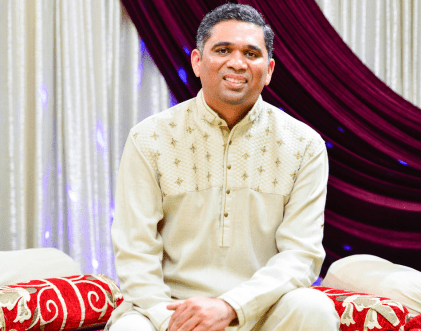 Traditional Indian music performer seated on stage – Rang-E-Mohabbat